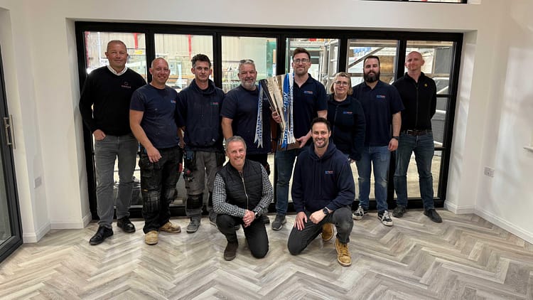 The SafeGuard team with the Vertu trophy before the showroom opening